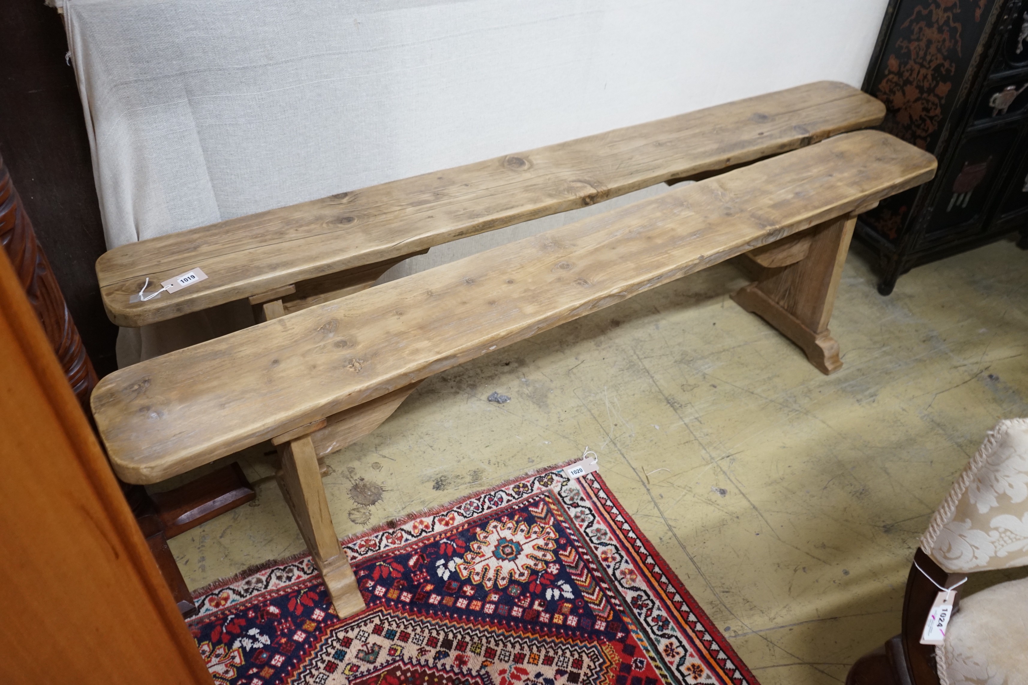 A pair of 19th century provincial pine benches, length 179cm, depth 22cm, height 47cm